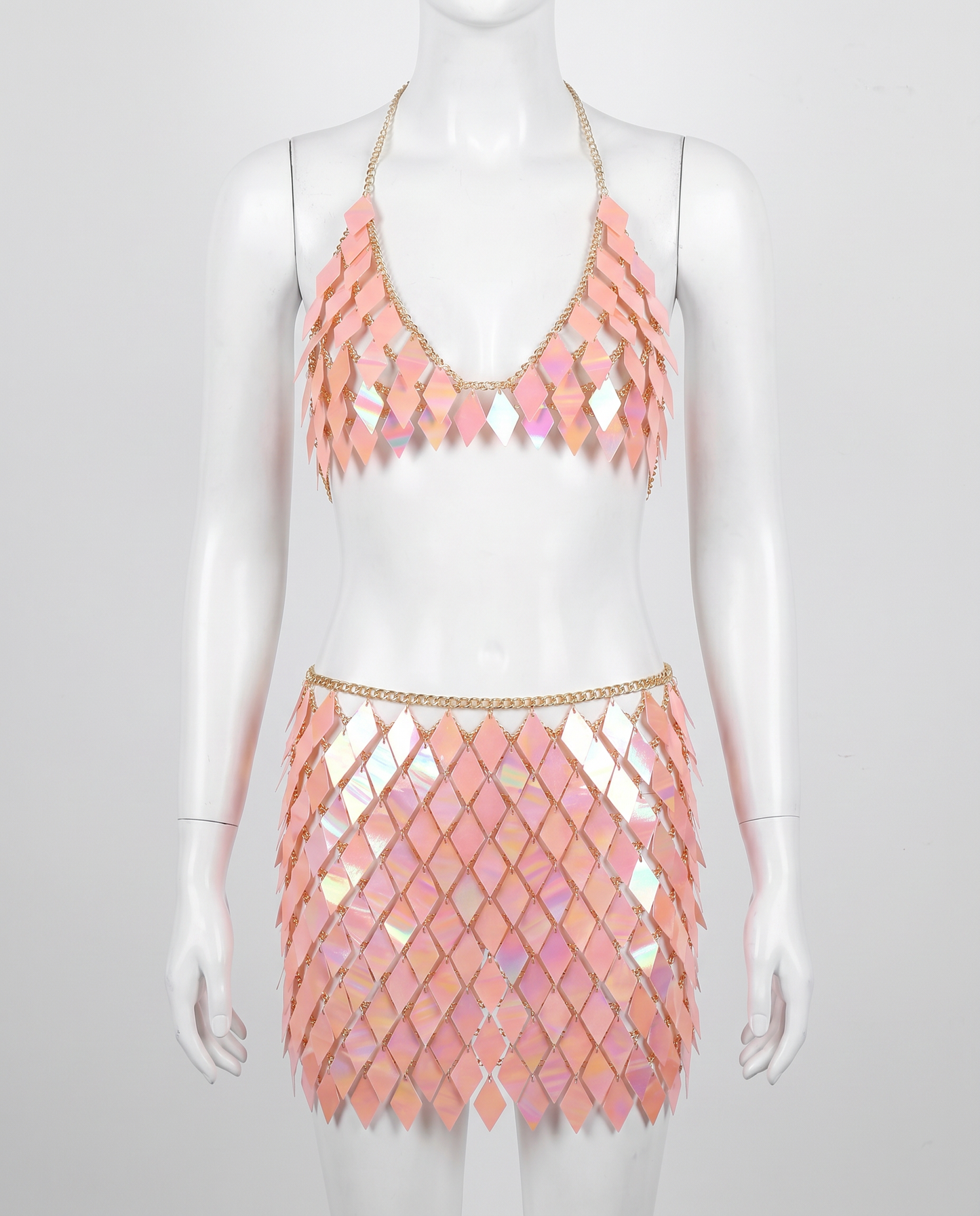 Iridescent pink festival outfit with diamond-shaped sequin top and matching skirt on mannequin