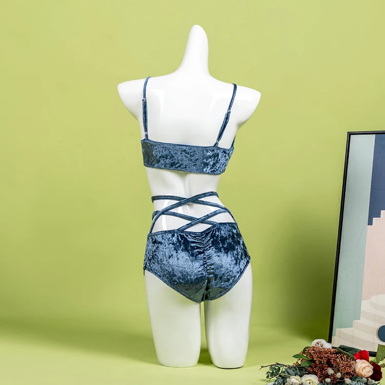 Back view of teal velvet sculpt set showing compression fit and halter neck.