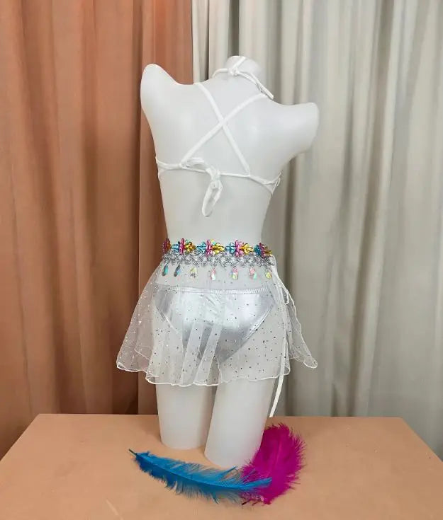 Y2K-inspired, prismatic bodycon mini skirt with rhinestone-embellished belt and high-refraction crystals, perfect for rave or festival performance wear.