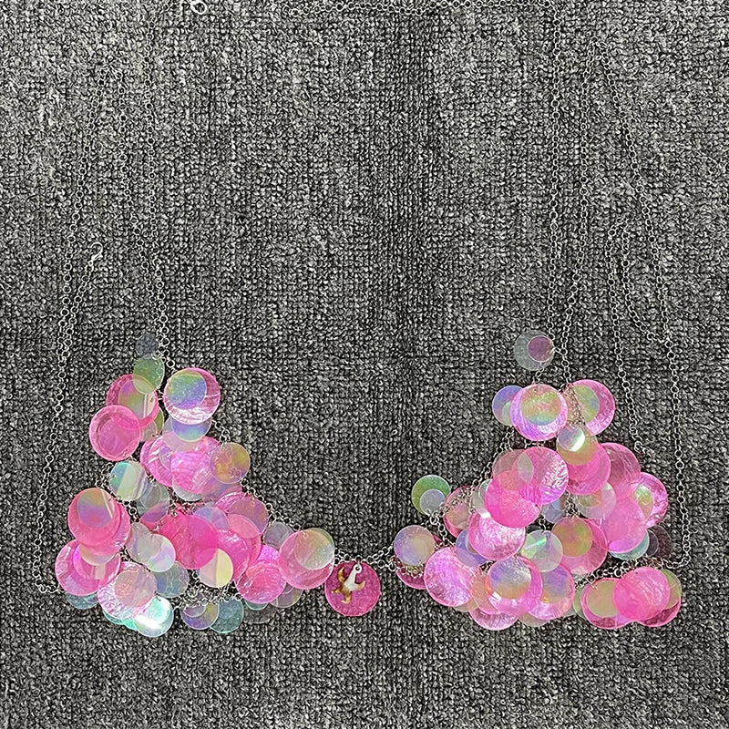 Y2K-inspired, prismatic bodycon bra with high-refraction crystals and pink rhinestone-embellished discs, perfect for rave and festival wear