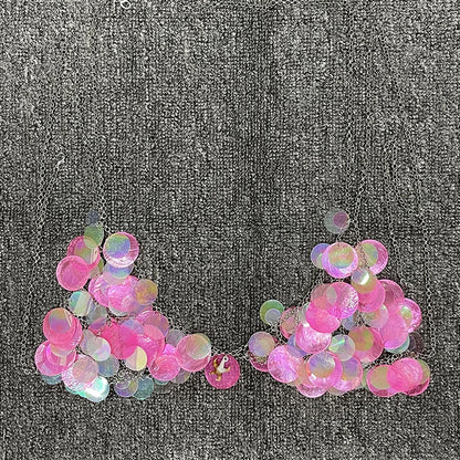 Y2K-inspired, prismatic bodycon bra with high-refraction crystals and pink rhinestone-embellished discs, perfect for rave and festival wear