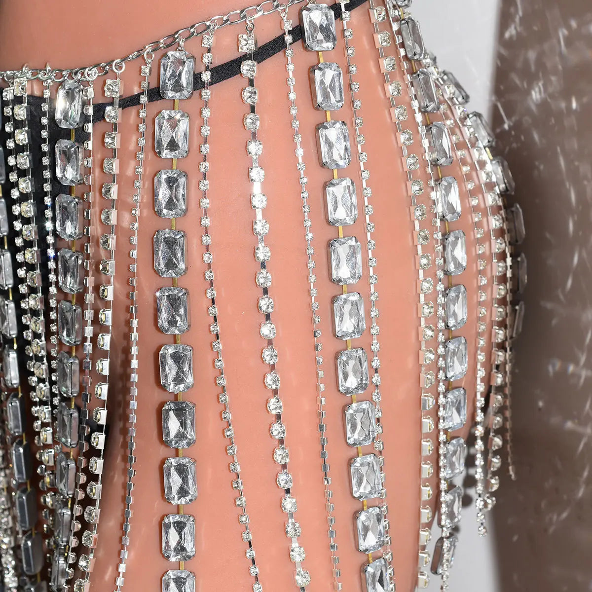 Y2K-inspired bodycon skirt with high-refraction crystal rhinestone fringe, prismatic festival wear