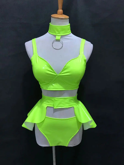 High-vis green high-gloss rave outfit featuring moisture-wicking stretch fabric and a second-skin fit for high-intensity festival dancing.
