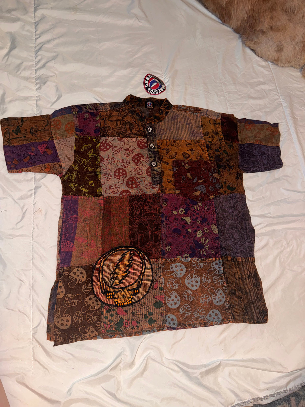 Patchwork jacket with colorful patterns on a white background