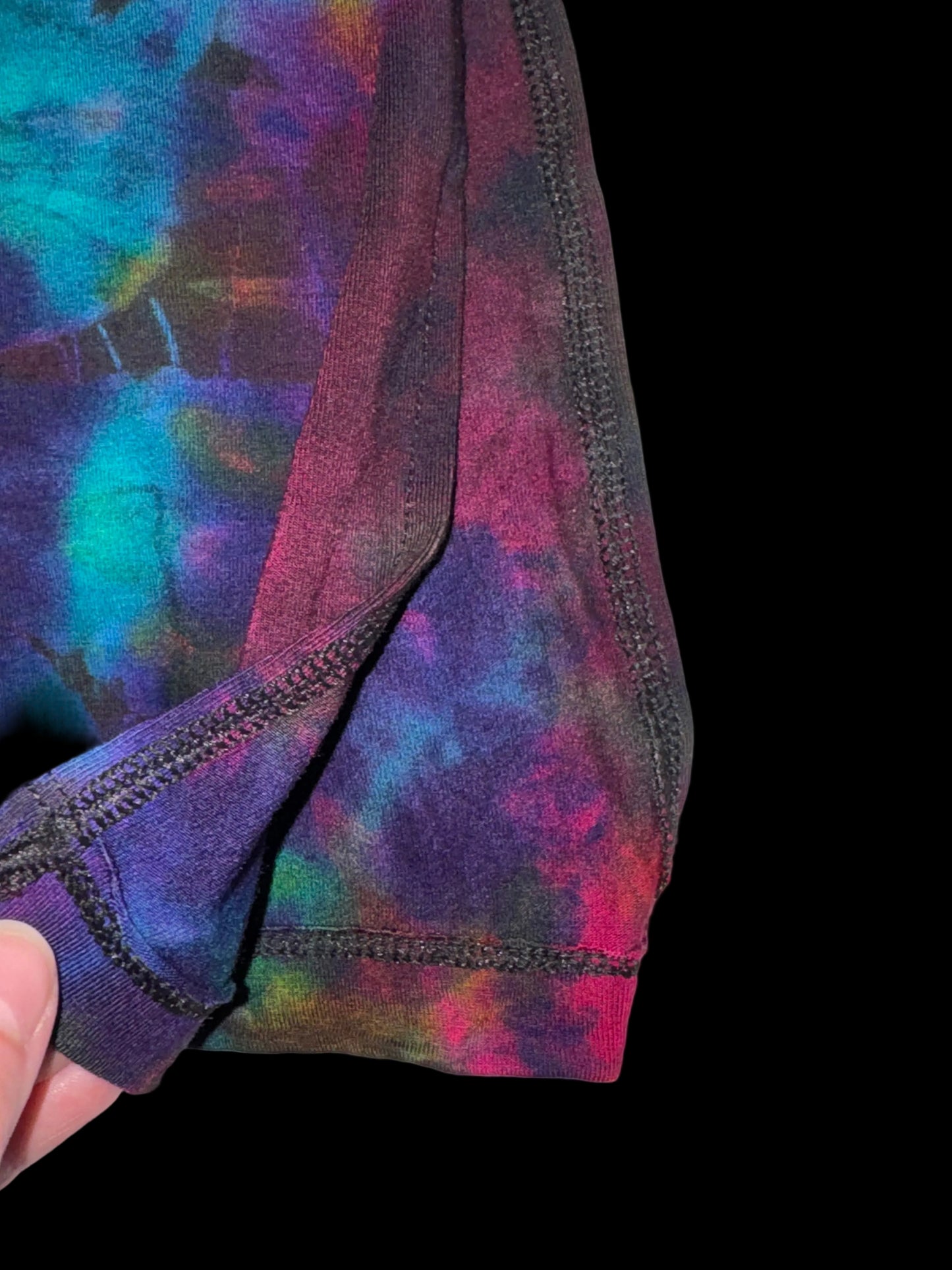 Colorful tie-dye pattern on a fabric with a white background