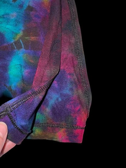 Colorful tie-dye pattern on a fabric with a white background