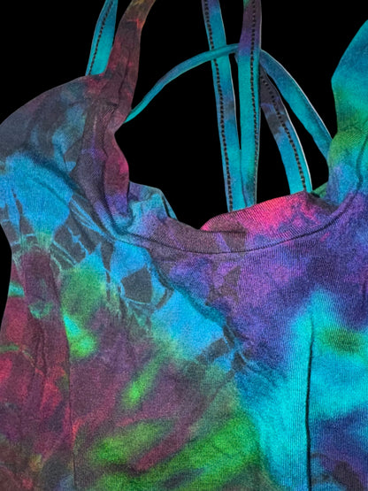 Close-up of a colorful tie-dye hoodie with vibrant patterns on a white background