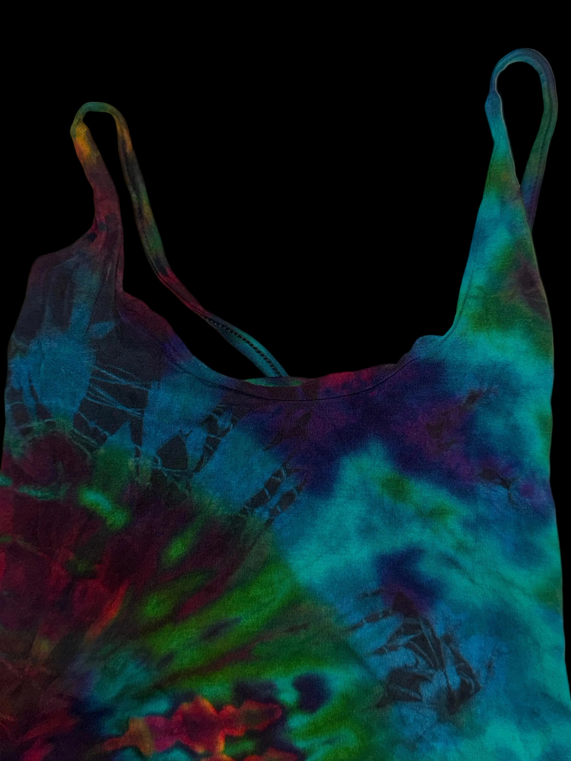 Colorful tie-dye dress with a floral pattern on a white background