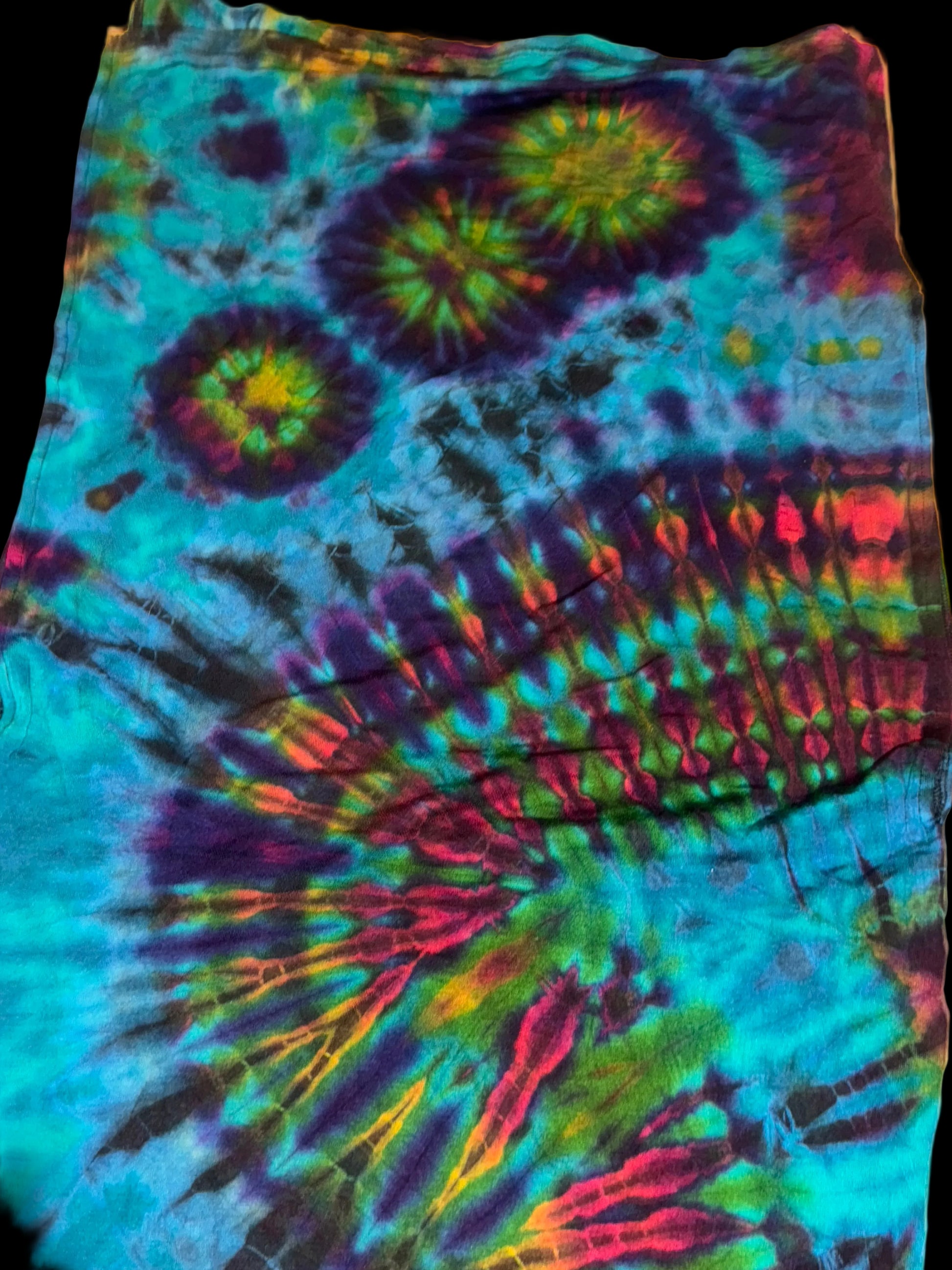 Tie-dye fabric with multicolor pattern on a white background