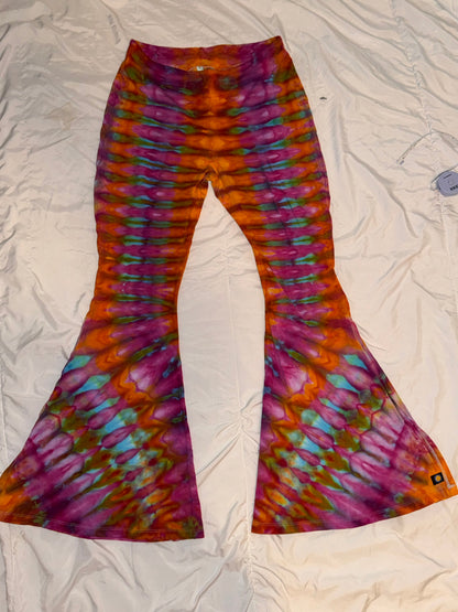 Colorful tie-dye patterned fabric on a textured white surface