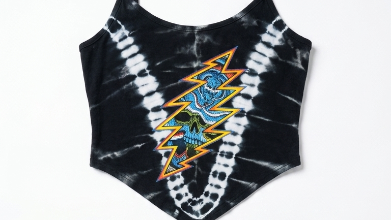 Black tie-dye crop top and shorts set with colorful designs on a white background